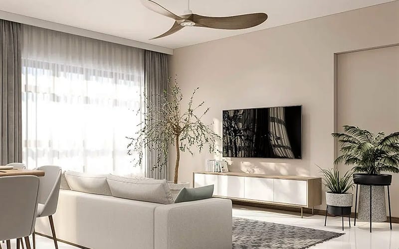 Large television wall mounted above a low media unit in a bright Sydney living room, cabling fully concealed